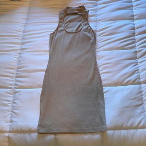 tan body-con dress with choker around neck
